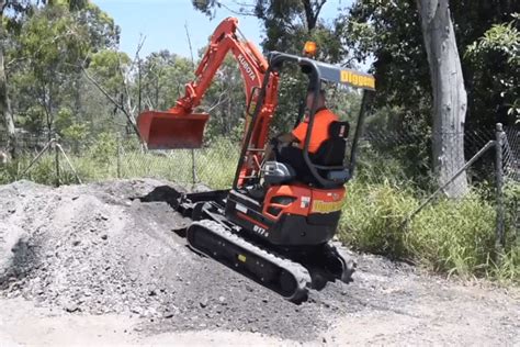 how steep of a hill can a mini excavator climb|mini ex up a slope.